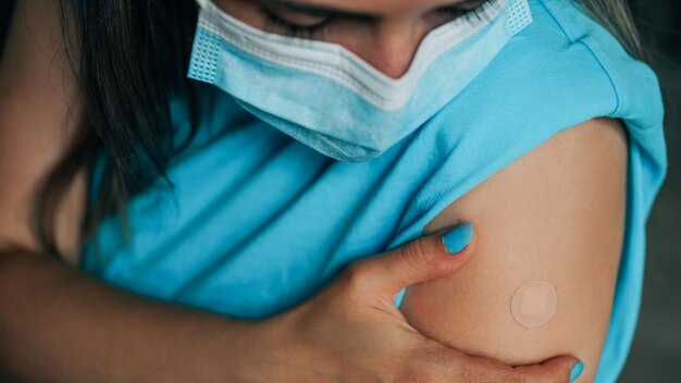 Girl is vaccined by the covid19 vaccine