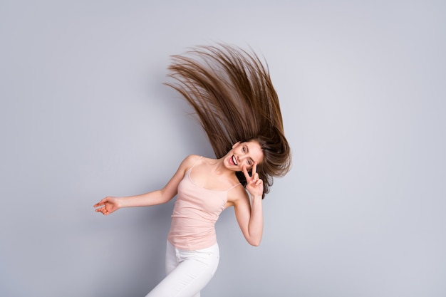 the girl is waving her healthy hair