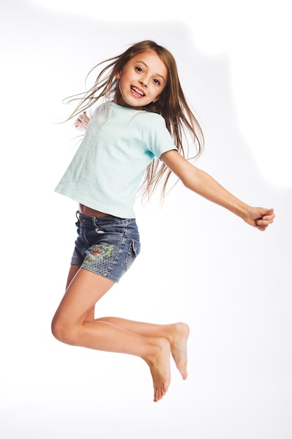 Girl jumps on a white background