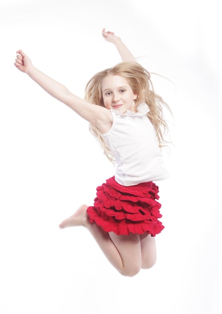 Photo girl jumps on a white background