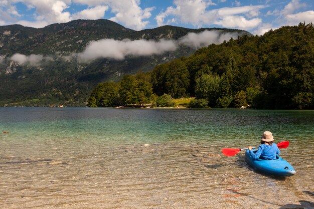 Girl kayaking in the Bohinj lake