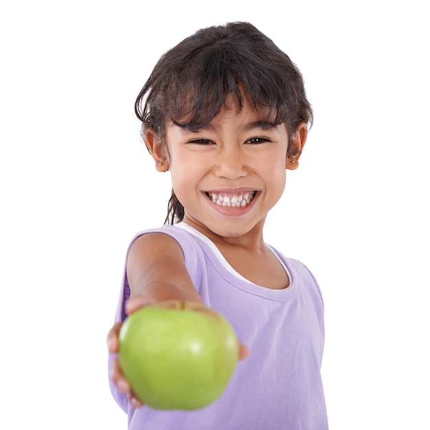 Girl kid and apple for health and portrait diet and vegan snack with nutrition and wellness on white background Organic fruit healthy food and vitamin c for balance and benefits in studio