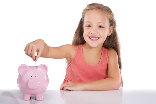 Photo girl kid piggy bank and coins for portrait studio and pride with smile for investing by white background child container or animal toys with relax for money cash or happy for financial education