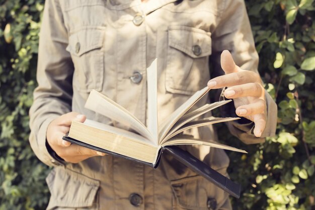 Girl leafing through the pages in a book