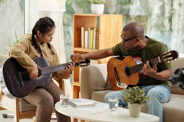 Girl Learning Playing Guitar