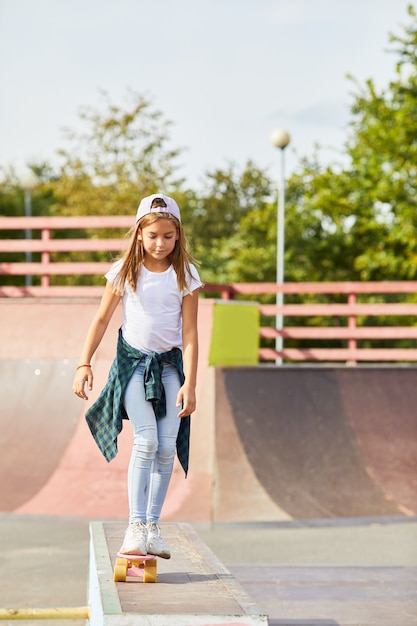 Girl learning to ride on skateboard