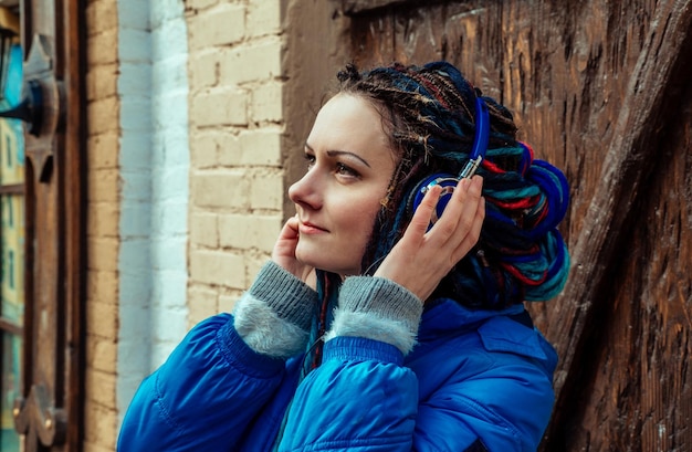 Girl listening to music on headphones