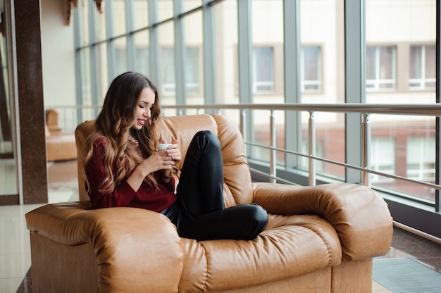 Girl listening to music through headphones on the tablet