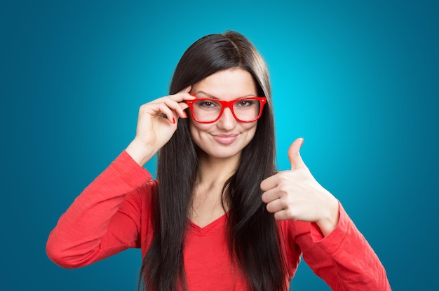 Girl looking over glasses studio shot