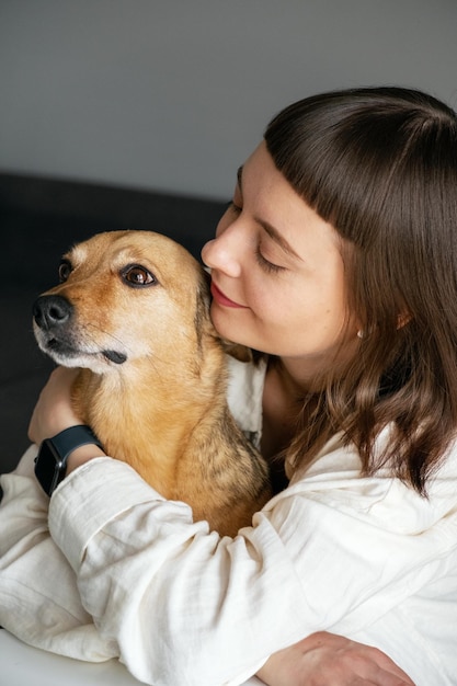 A girl looking at her dog