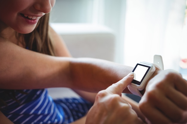 Girl looking at the smart watch