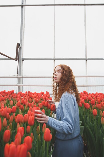 Girl looking up in orangery