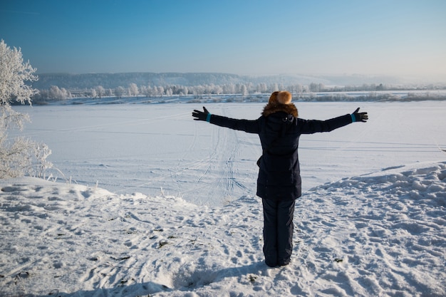 Girl looking on winter landscape, Siberia