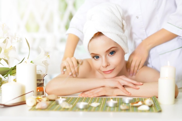 Girl lying down on a massage bed