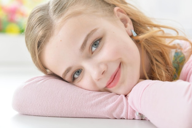 Girl lying on folded arms