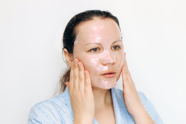 Girl makes a mask for the whole face on problem skin