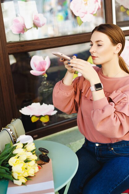 Girl makes a photo on the phone