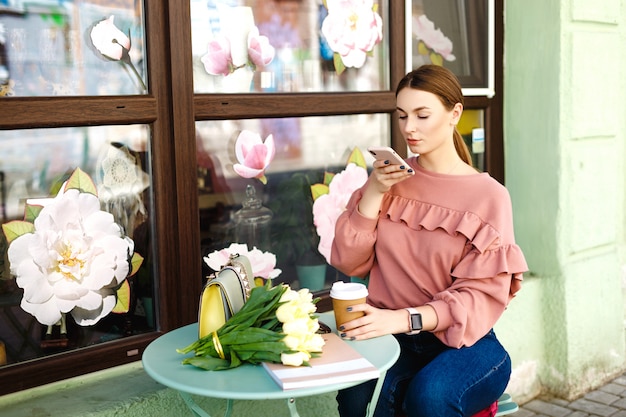 Girl makes a photo on the phone