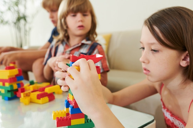 Girl making colorful tower