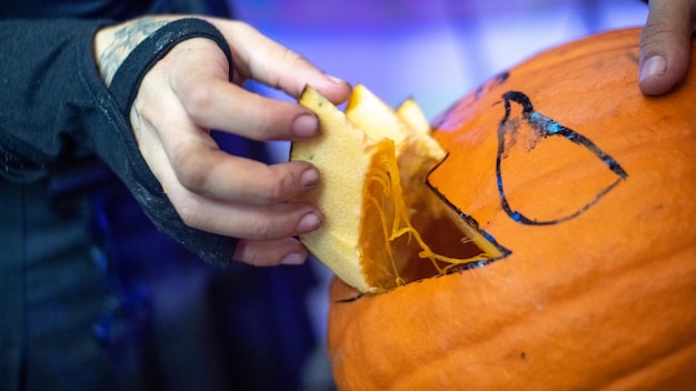 Girl making a halloween pumpkin