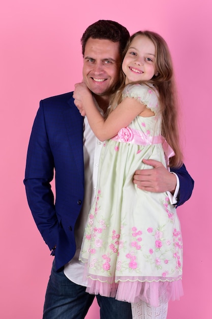 Girl and man with happy smiling faces on pink background
