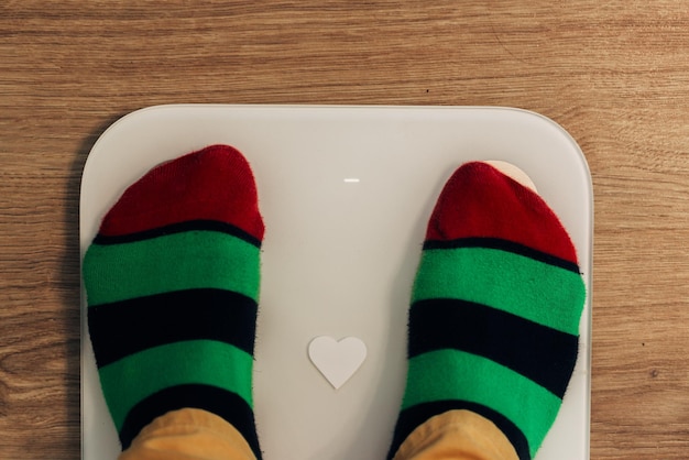 Girl Measures Weight During Diet. Smart Scales for Home.