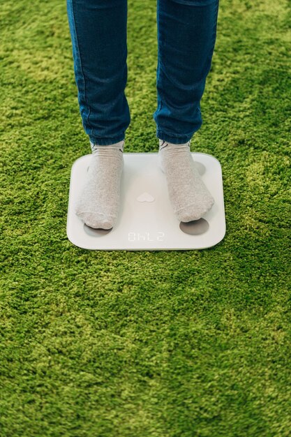 Girl Measures Weight on the Smart Scales