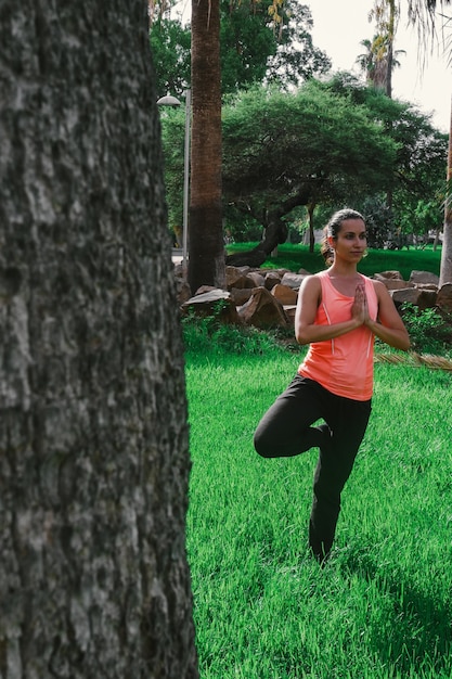 girl in the middle of the park lawn doing yoga
wellness moment