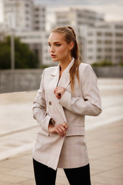 Girl model in a stylish light jacket