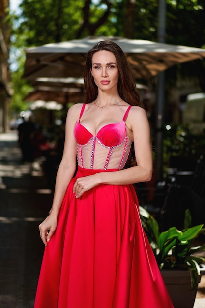 Girl model in a white dress on the street