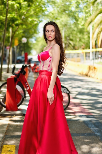 Girl model in a white dress on the street