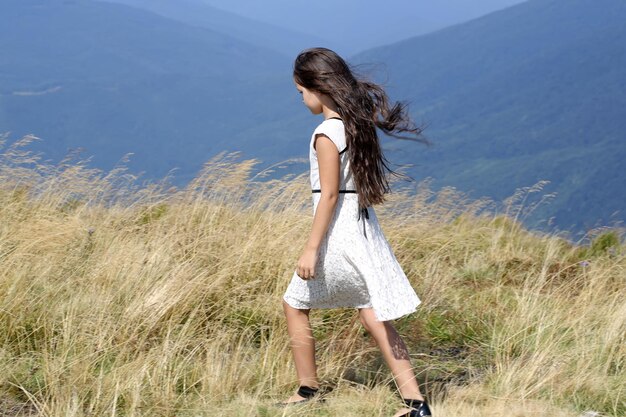 Girl in mountain valley