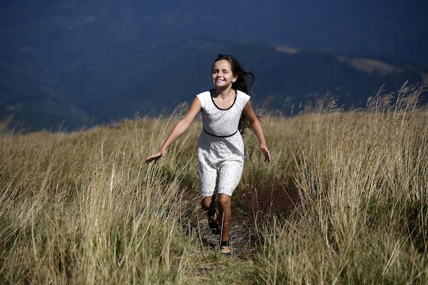 Girl in mountain valley