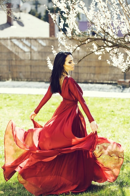 Girl near blooming tree