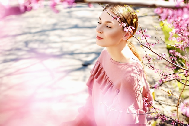 Girl near a flowering tree