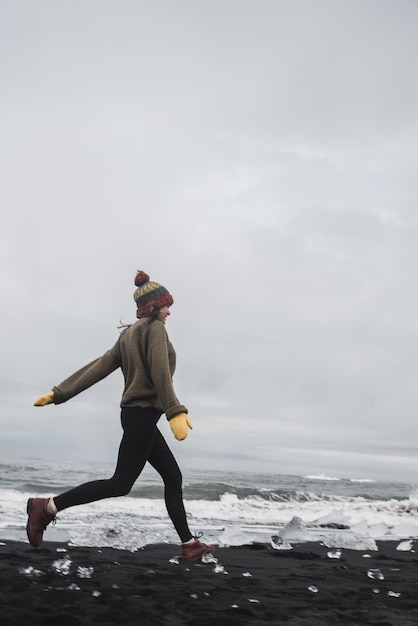 Girl near glacier in Iceland