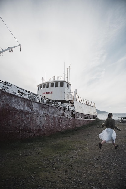 girl near the huge ship in Iceland