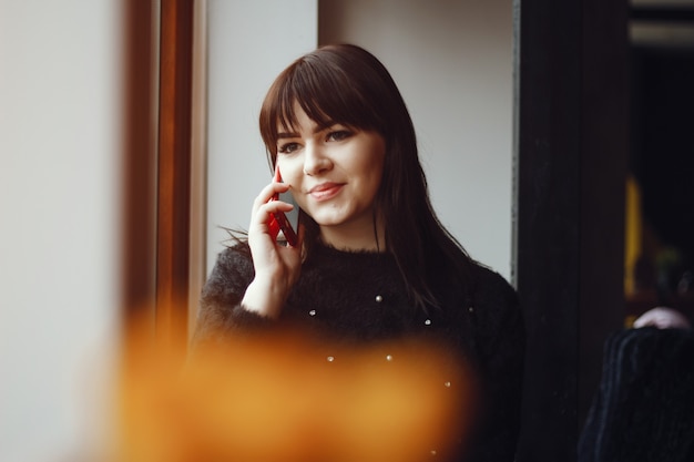 Girl near window