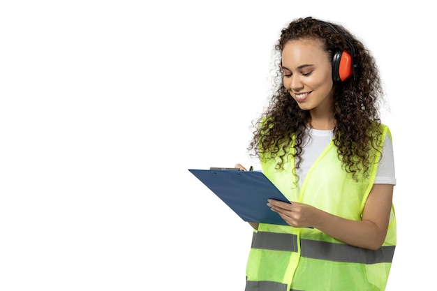 A girl in noiseabsorbing headphones and a folder isolated on white background