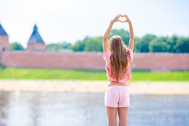 Girl at Novgorod Kremlin at Volkhov River