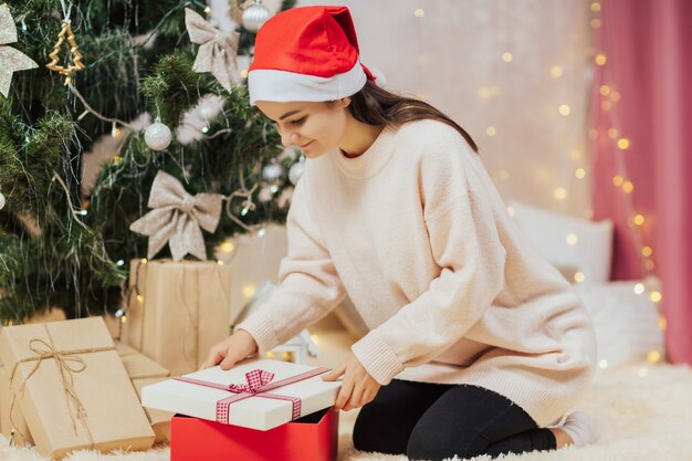 Girl opening gift box.