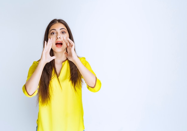 Girl opening her hands and calling for someone.