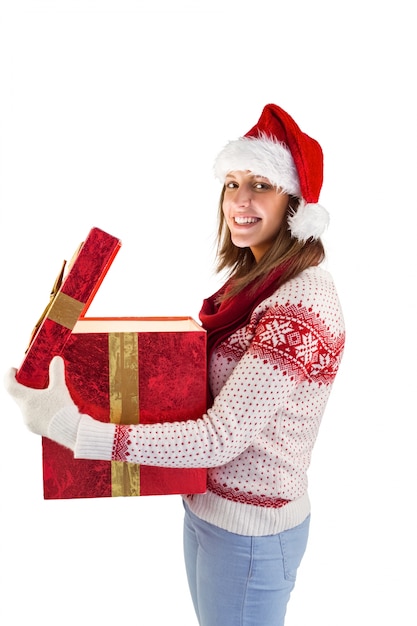 Girl opening a magical christmas gift