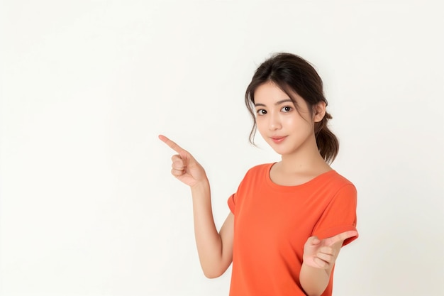 a girl in an orange shirt pointing to the right