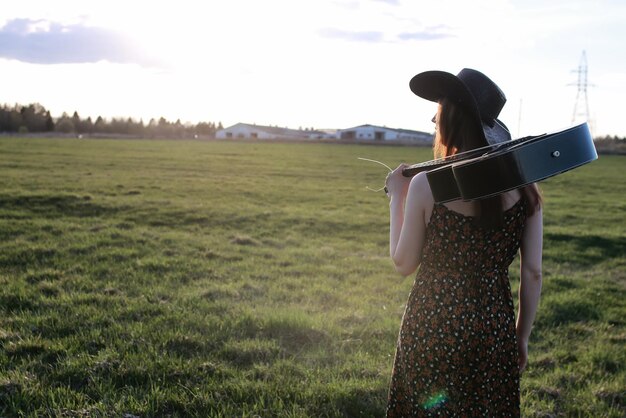 Girl outdoor field sunset texas hat