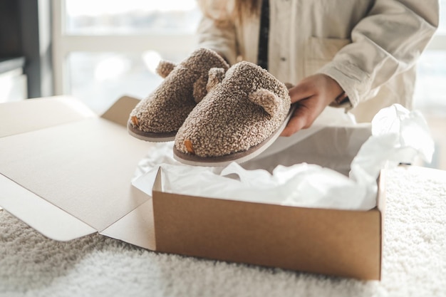 Girl packing slippers volunteering concept