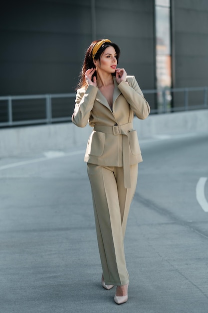 Girl in pantsuit on the street Business woman portrait