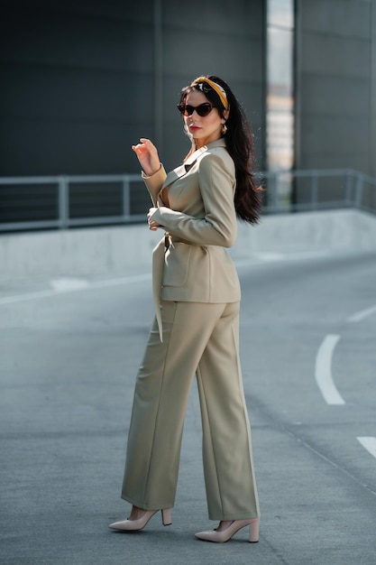 Girl in pantsuit on the street Business woman portrait