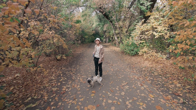 girl in the park dog pug