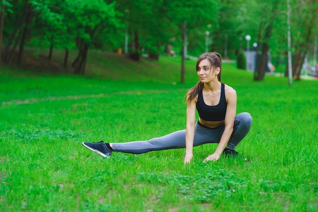 Girl in the park doing exercises